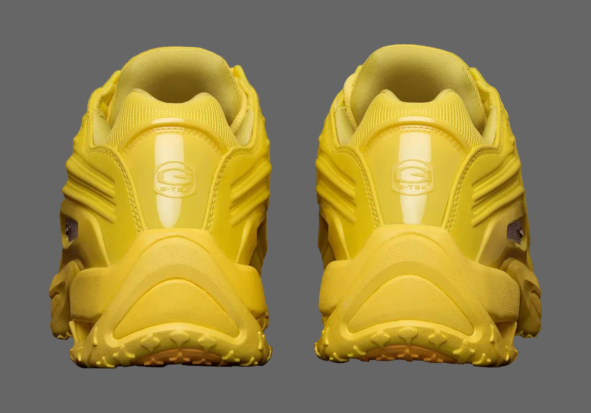 Nike Hot Step 2 Drake NOCTA Opti Yellow – sneaker futuriste jaune vif avec détails réfléchissants et technologie Nike Air, vue de dos