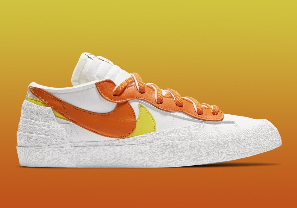 Nike Blazer Low x sacai Magma Orange – sneaker orange vif avec double Swoosh et semelle intermédiaire empilée, vue de face