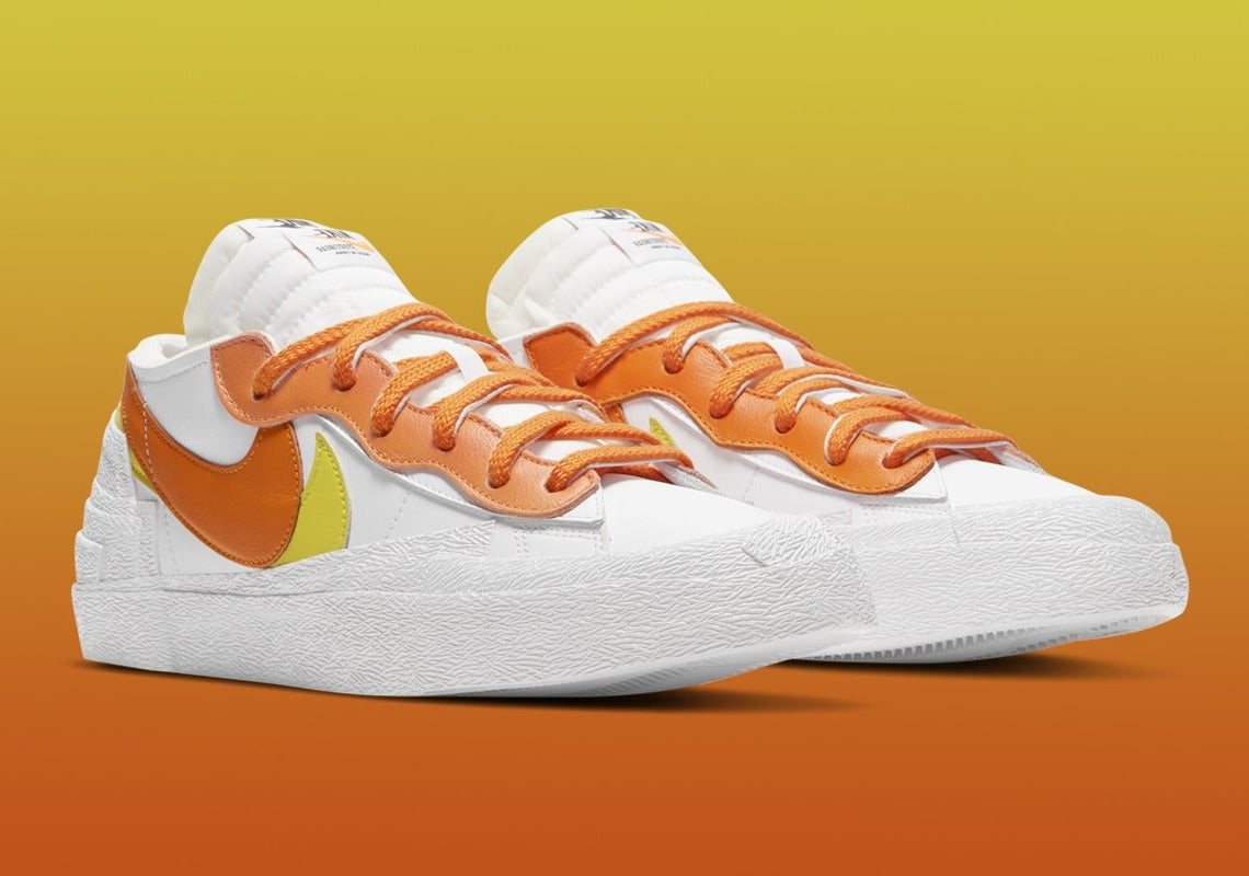 Nike Blazer Low x sacai Magma Orange – sneaker orange vif avec double Swoosh et semelle intermédiaire empilée, vue de profil
