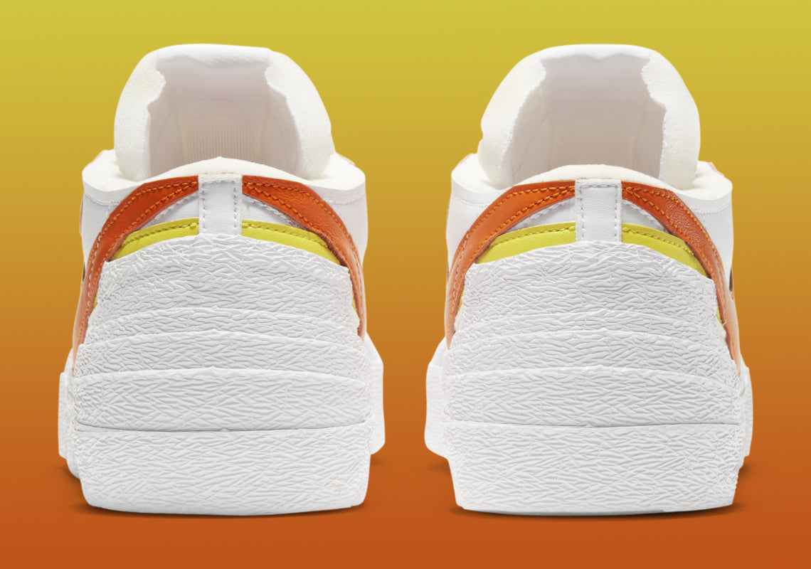 Nike Blazer Low x sacai Magma Orange – sneaker orange vif avec double Swoosh et semelle intermédiaire empilée, vue arrière