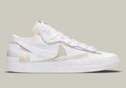 Nike Blazer Low sacai White Patent Leather – sneaker en cuir verni blanc avec double Swoosh et semelle empilée, vue de face