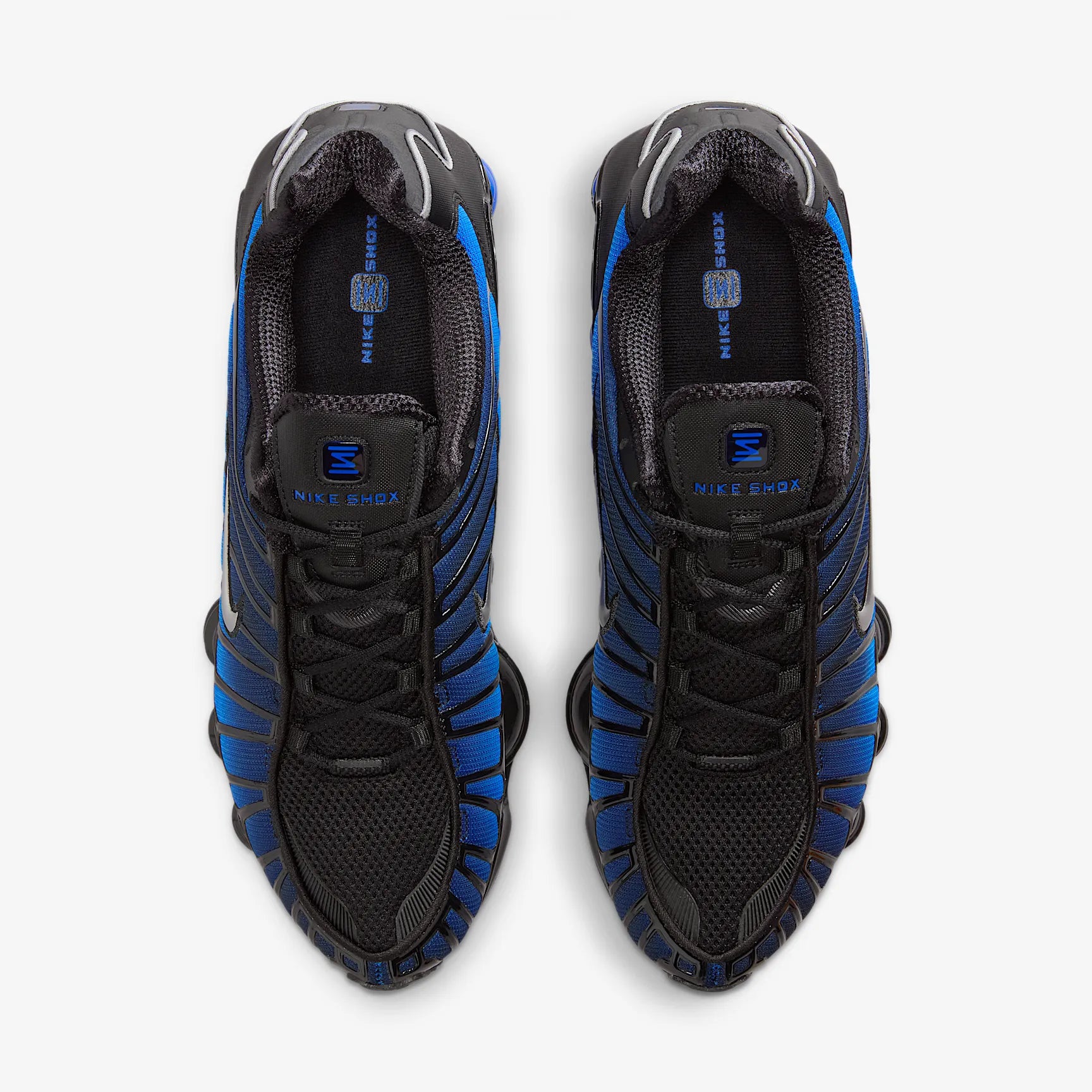 Nike Shox TL Game Royal Black noires avec détails bleu Game Royal et amorti Nike Shox intégral.