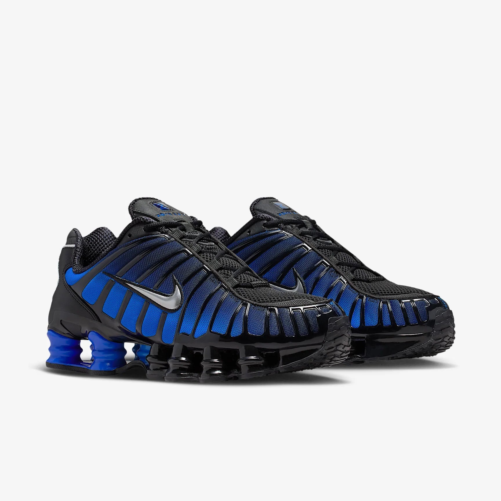 Nike Shox TL Game Royal Black noires avec détails bleu Game Royal et amorti Nike Shox intégral.