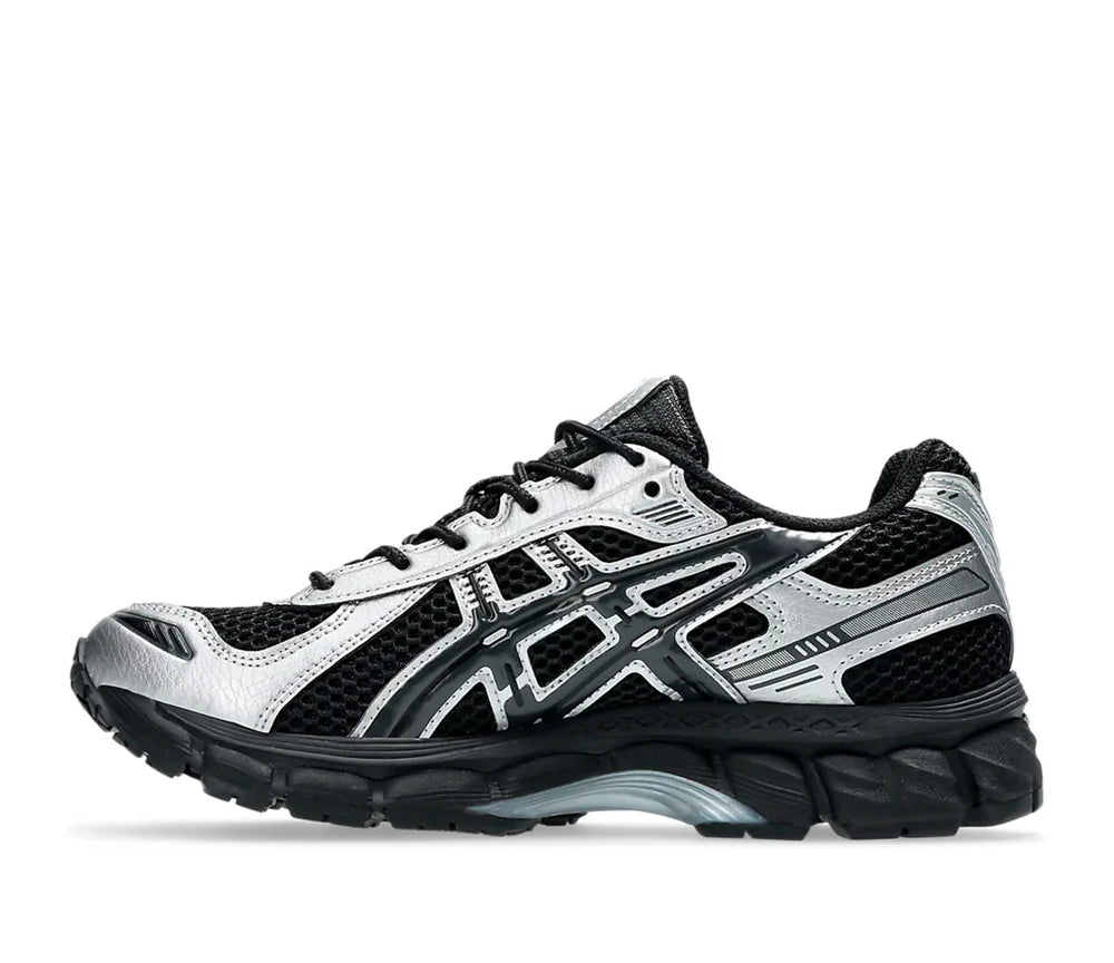 ASICS Gel-Kayano 12.1 Black Pure Silver en mesh noir avec détails argentés métallisés, amorti GEL et silhouette rétro-running technique.