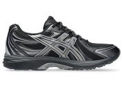 ASICS Gel-Sekiran Black Carbon en mesh noir avec détails gris anthracite, amorti GEL et silhouette technique contemporaine.