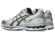 Sneaker ASICS Gel-Kayano 12.1 Cream Carbon en mesh crème et gris anthracite avec amorti GEL et silhouette rétro-running premium.