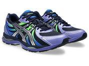 ASICS Gel-Sekiran Midnight Pure Silver en mesh bleu nuit avec détails argentés métallisés, amorti GEL et silhouette technique contemporaine.