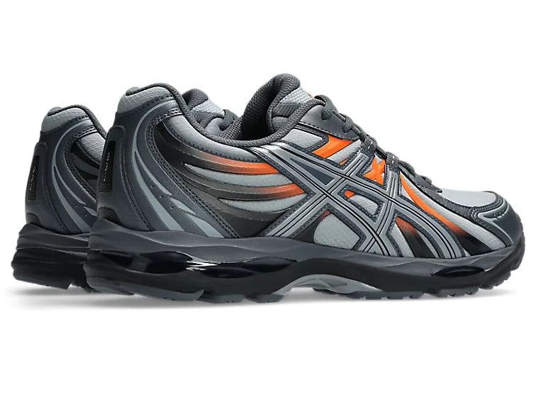 ASICS Gel-Sekiran Piedmont Grey Orange en mesh gris avec détails orange vif, amorti GEL et silhouette technique contemporaine.