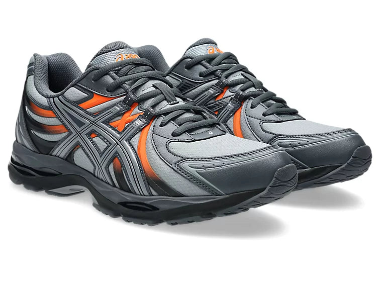 ASICS Gel-Sekiran Piedmont Grey Orange en mesh gris avec détails orange vif, amorti GEL et silhouette technique contemporaine.