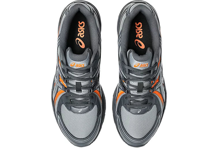 ASICS Gel-Sekiran Piedmont Grey Orange en mesh gris avec détails orange vif, amorti GEL et silhouette technique contemporaine.