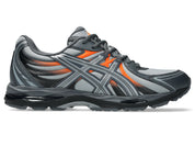 ASICS Gel-Sekiran Piedmont Grey Orange en mesh gris avec détails orange vif, amorti GEL et silhouette technique contemporaine.