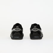 Sneaker ASICS GT-2160 Black Pure Silver en mesh noir avec détails argentés métallisés et amorti GEL performant.