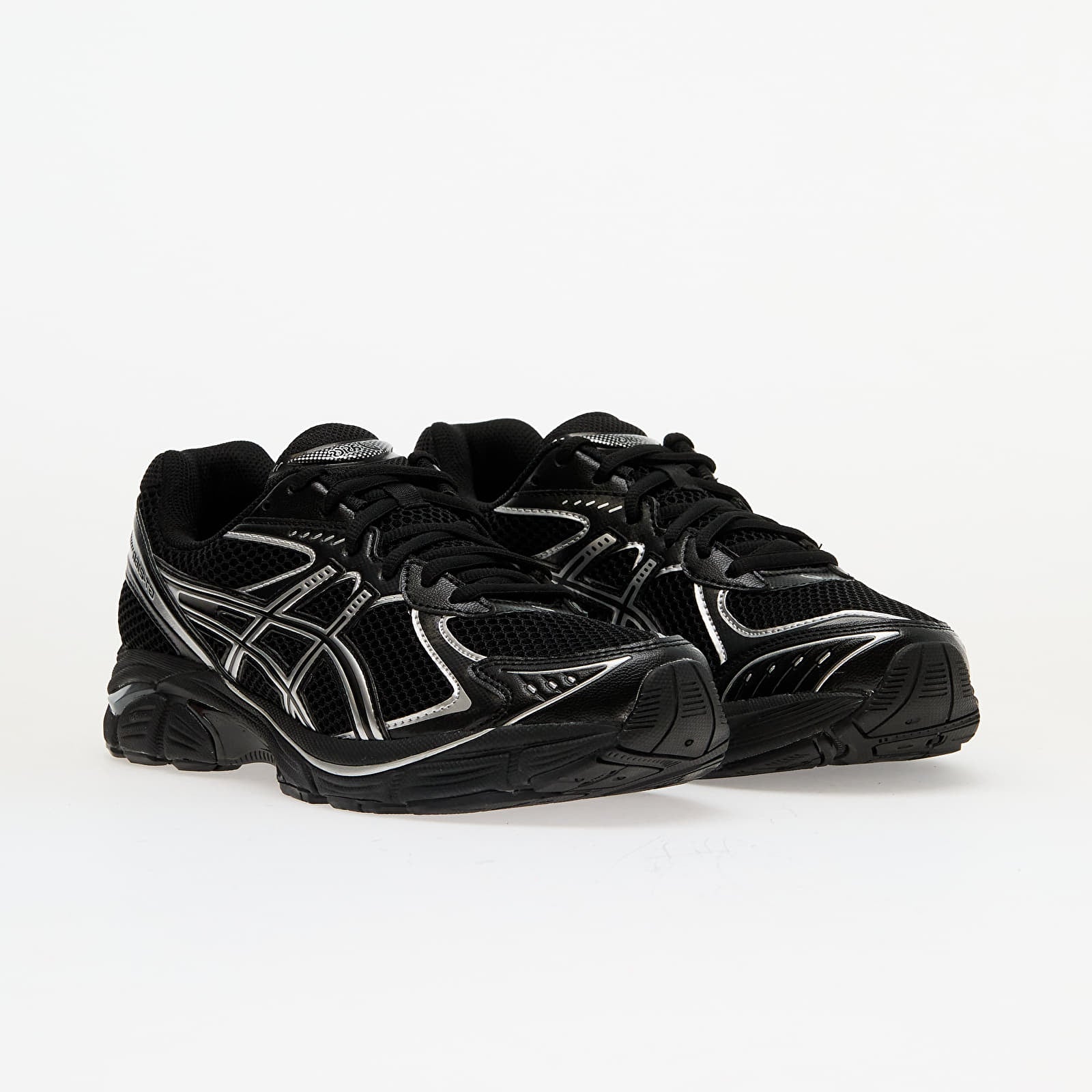 Sneaker ASICS GT-2160 Black Pure Silver en mesh noir avec détails argentés métallisés et amorti GEL performant.