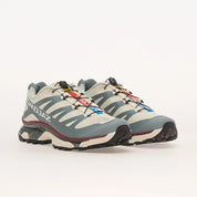 Sneakers Salomon XT-4 OG en mesh technique avec renforts synthétiques, coloris Vanilla Ice et Ice Flow, semelle trail avec technologie Agile Chassis System.