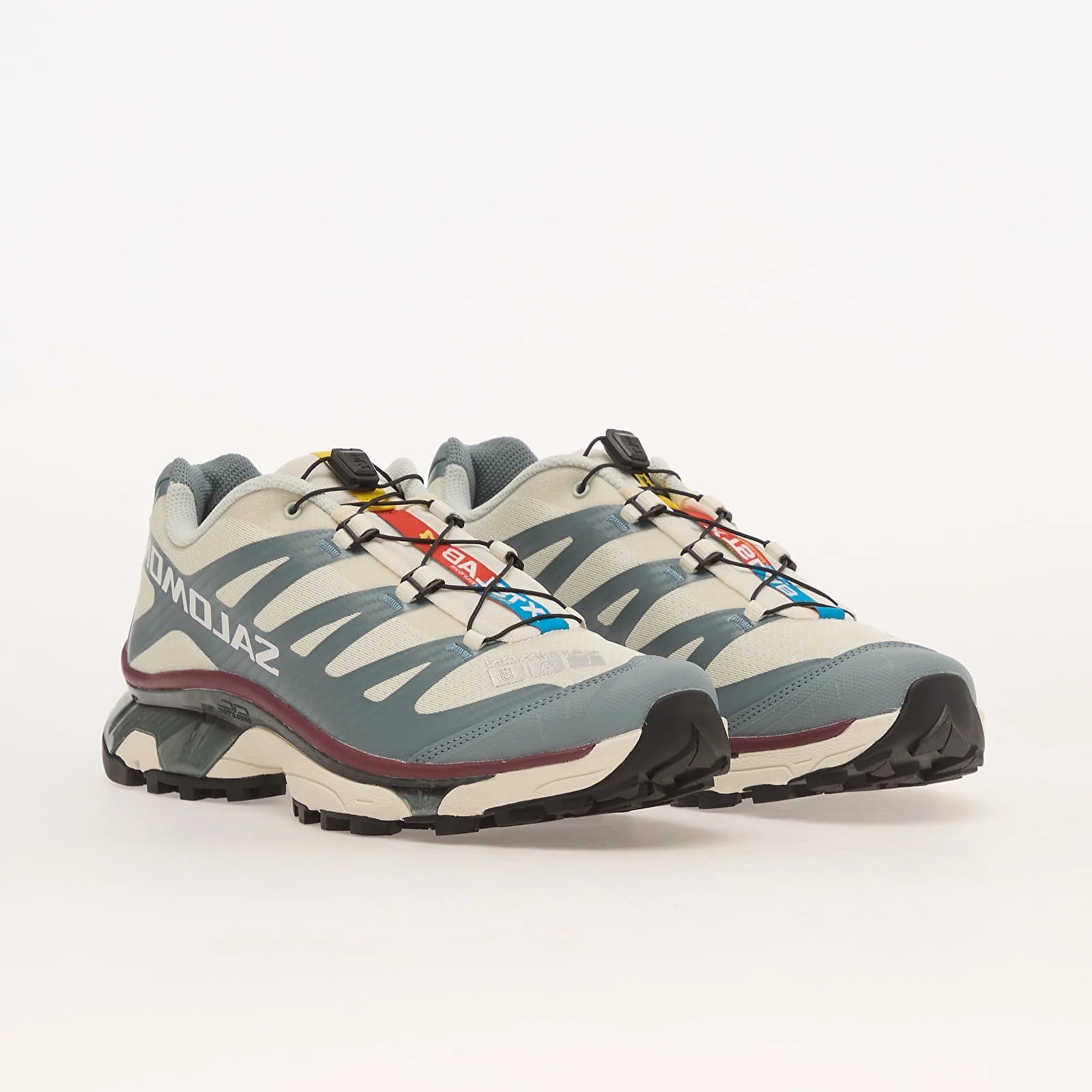 Sneakers Salomon XT-4 OG en mesh technique avec renforts synthétiques, coloris Vanilla Ice et Ice Flow, semelle trail avec technologie Agile Chassis System.