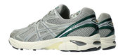 Sneaker ASICS GT-2160 Seal Grey Jewel Green en mesh gris avec détails verts et amorti GEL pour un confort optimal.