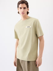 Tee-shirt JACQUEMUS Gros Grain Light Khaki, haut en coton kaki clair avec détail gros-grain discret et coupe épurée.