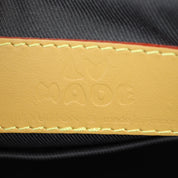 Louis Vuitton x Nigo City Keepall Monogram Stripes Brown, sac Louis Vuitton compact en toile Monogram marron avec détails Stripes, doubles poignées et bandoulière.
