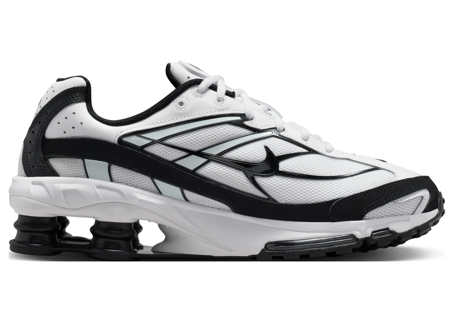 vNike Shox Ride 2 White Black avec tige en mesh respirant blanc, empiècements synthétiques noirs, amorti Nike Shox au talon et semelle extérieure en caoutchouc vue de profil intérieur. 