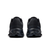 On Running Cloudtilt Black Eclipse, sneaker noire On Running équipée de la technologie CloudTec Phase® et de l'amorti Helion™ pour un confort optimal au quotidien vue de derrière. 
