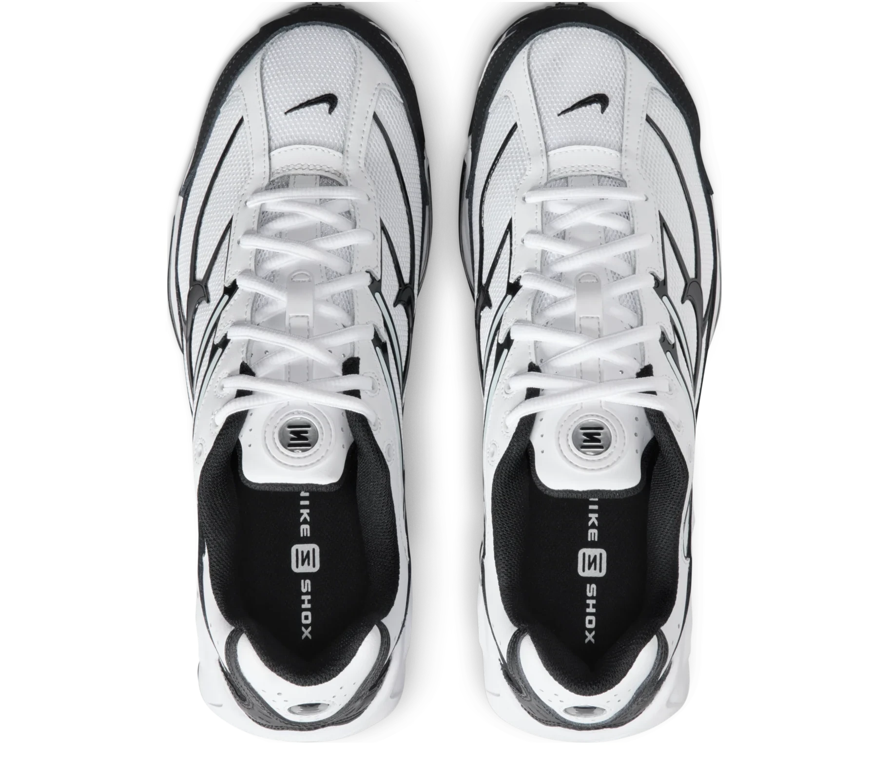 Nike Shox Ride 2 White Black avec tige en mesh respirant blanc, empiècements synthétiques noirs, amorti Nike Shox au talon et semelle extérieure en caoutchouc vue du dessus. 