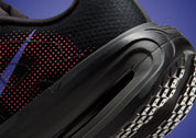 Sneakers Nike Vomero Premium femme en Black, Sapphire et Rose avec mesh respirant et amorti Zoom Air premium.