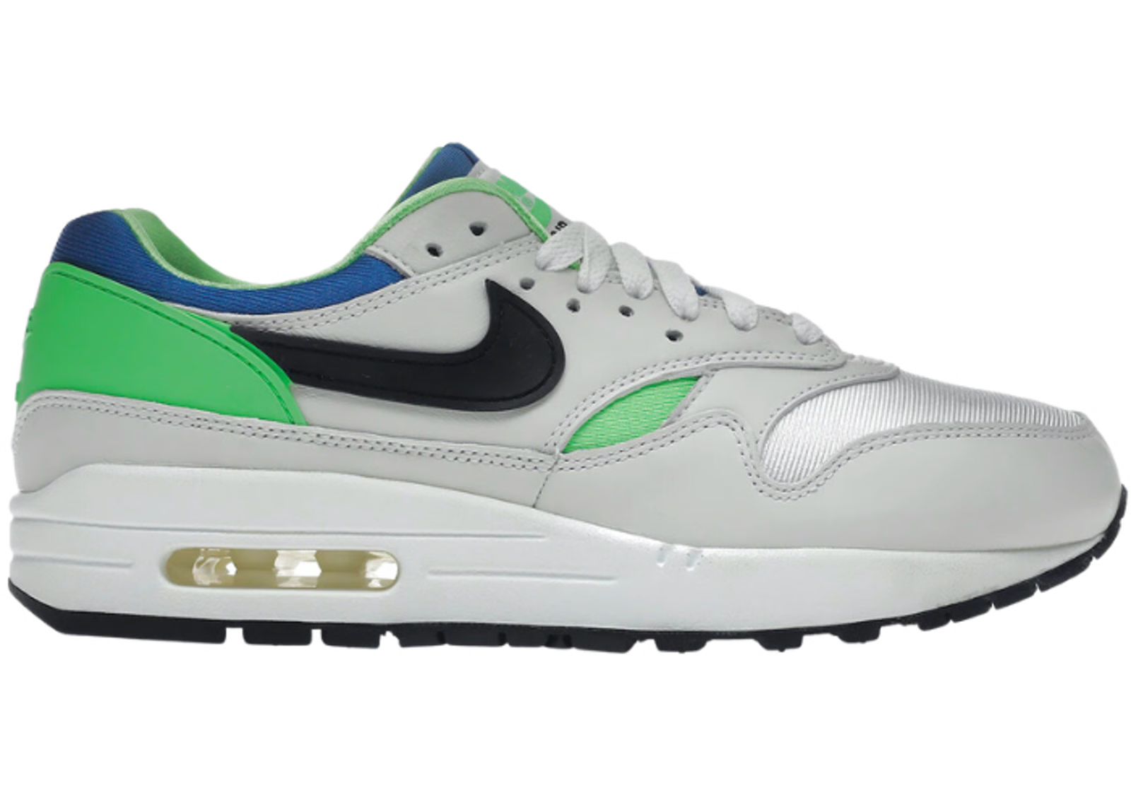 Image de la Nike Air Max 1 DNA CH.1 Green Royal, sneaker en mesh, cuir et suede avec accents verts et bleus et bulle d’air visible. (vue de profil)