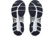 ASICS Gel-Cumulus 16 White Midnight en mesh blanc avec détails bleu nuit, amorti GEL et silhouette rétro-running technique.