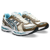 ASICS Gel-Kayano 12.1 Brown Blue en mesh brun avec détails bleus, amorti GEL et silhouette rétro-running technique.