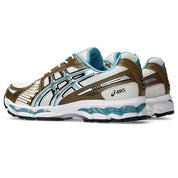 ASICS Gel-Kayano 12.1 Brown Blue en mesh brun avec détails bleus, amorti GEL et silhouette rétro-running technique.