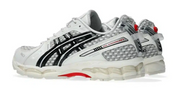 ASICS Gel-Kayano 12.1 PACE Cream Black crème et noire avec superpositions texturées, branding PACE et semelle GEL FLUIDRIDE.