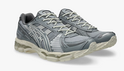 ASICS Gel-Kayano 12.1 Piedmont Grey Gravel grise avec mesh respirant, empiècements techniques et semelle GEL FLUIDRIDE.