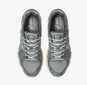 ASICS Gel-Kayano 12.1 Piedmont Grey Gravel grise avec mesh respirant, empiècements techniques et semelle GEL FLUIDRIDE.
