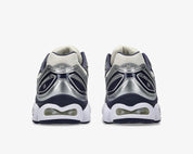 ASICS Gel-Nimbus 9 en mesh Oatmeal avec détails Indigo Fog et amorti GEL visible.