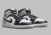 Chaussure de ville Air Jordan 1 Mid Barons   , noir , blanc , gris , semelle confortable , vu de 3/4