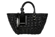 Balenciaga Bistro XS Basket Top Handle Bag Black en matière noire brillante avec deux anses roulées, étiquette siglée et bandoulière amovible.