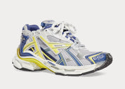 Balenciaga Runner White Blue Yellow Grey Black avec tige en mesh respirant, empiècements en cuir multicolore, semelle intermédiaire en mousse et silhouette inspirée du running vintage.