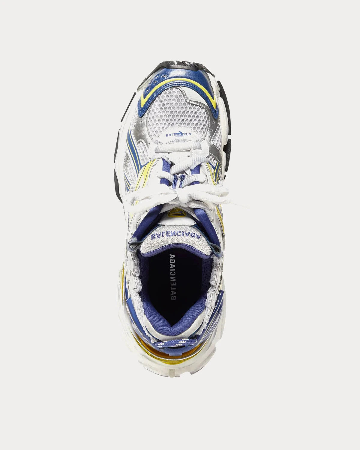 Balenciaga Runner White Blue Yellow Grey Black avec tige en mesh respirant, empiècements en cuir multicolore, semelle intermédiaire en mousse et silhouette inspirée du running vintage.