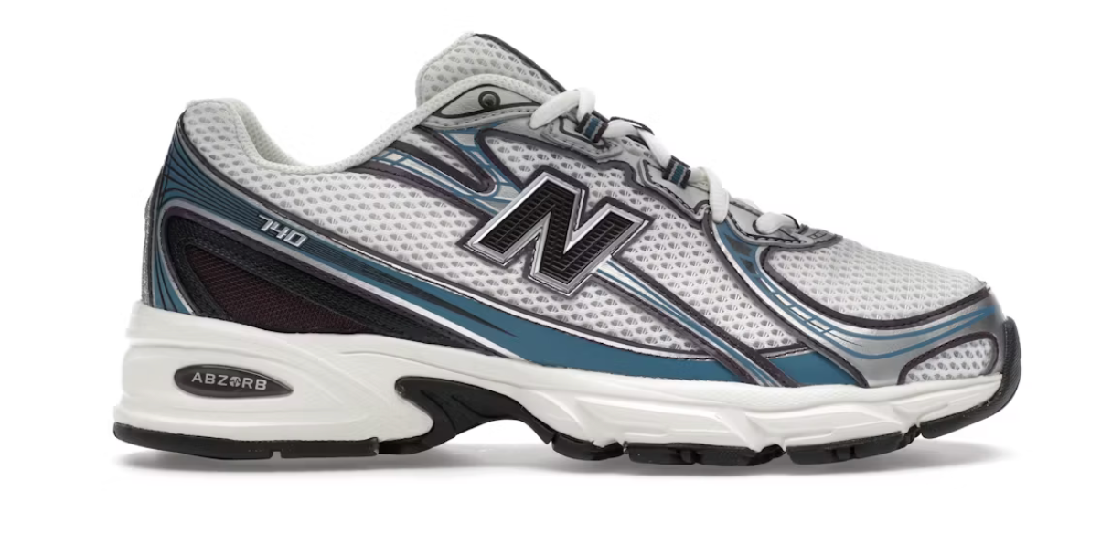  chaussure de sport new balance 740 blanche et bleu , semelle légère , vu de profil