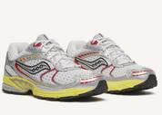 Saucony ProGrid Ride 1 White Buttercup avec tige en mesh respirant, empiècements synthétiques blancs et jaunes Buttercup, technologie ProGrid et semelle extérieure en caoutchouc.