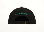 Casablanca Hotel Emblem Cap Black, casquette Casablanca noire à visière courbée avec Hotel Emblem sur l’avant et fermeture ajustable.