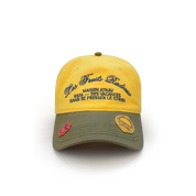 
Casquette Maison Atnav "Le Citron", casquette jaune citron et vert olive avec broderie Maison Atnav, visière préformée et écussons décoratifs.