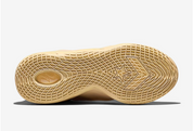 Converse SHAI 001 Butter, sneaker de basketball jaune crème monochrome avec empeigne moulée, fermeture zippée et silhouette futuriste.