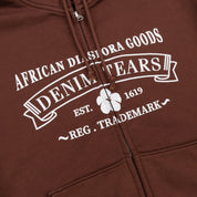 Denim Tears ADG Zip Hoodie Brown, sweat à capuche zippé marron Denim Tears avec manches longues et détails graphiques.