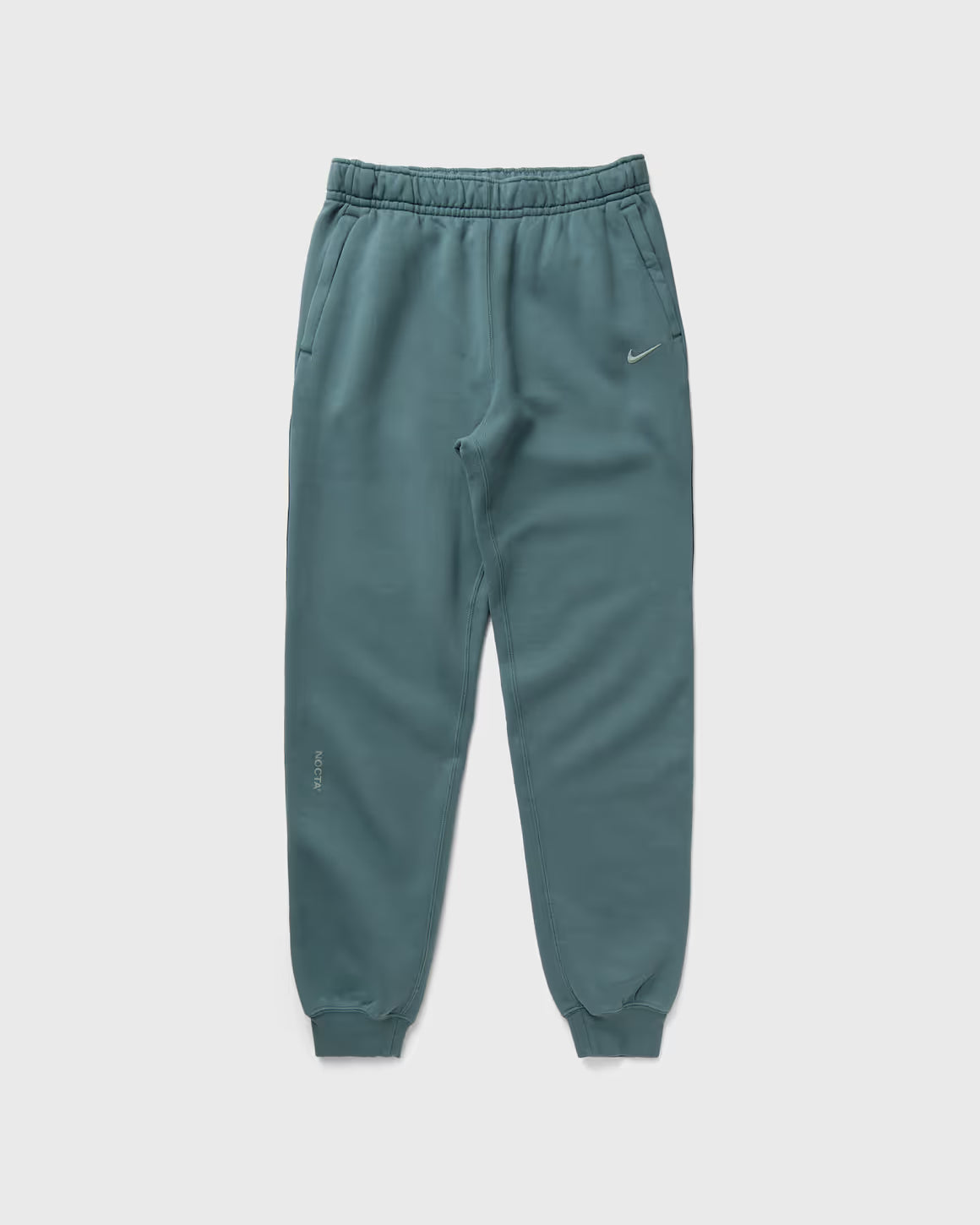 Nike x NOCTA Fleece CS Sweatpant Petrol, pantalon de survêtement vert pétrole en fleece avec chevilles côtelées et poches zippées NOCTA.