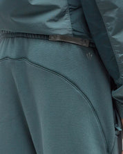 Nike x NOCTA Fleece CS Sweatpant Petrol, pantalon de survêtement vert pétrole en fleece avec chevilles côtelées et poches zippées NOCTA.