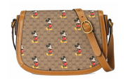 Gucci x Disney Shoulder Bag Mini GG Supreme Mickey Mouse Small Beige en canvas GG Supreme beige et ébène avec imprimé Mickey Mouse, cuir brun et détails dorés.
