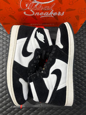 Jordan 1 Retro High Twist d’occasion en état 9/10, cuir blanc et poils noirs, silhouette haute iconique, sneaker avec boîte.