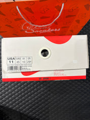 Jordan 1 High Rétro Nigel Sylvester d’occasion en état 8,5/10, cuir blanc patiné, détails crème et noirs, sneaker avec boîte.