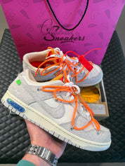 Sneakers Nike Dunk Low Off-White Lot 31 en cuir gris clair avec double laçage, zip tie signature et condition 9,9 sur 10.
